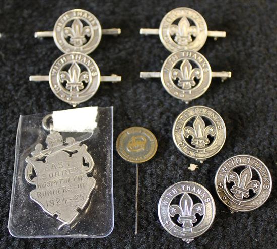 Collection of silver scout badges